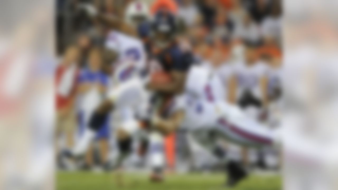 Denver Broncos wide receiver Eddie Royal (19) is tackled by Buffalo Bills safety Jon Corto (33) in the second quarter of a preseason NFL football game, Saturday, Aug. 20, 2011, in Denver.  (AP Photo/Chris Schneider)