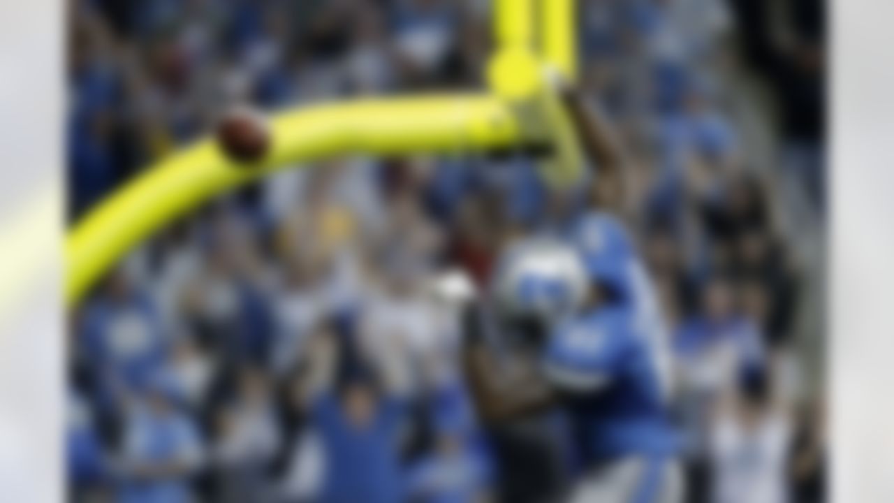 Detroit Lions wide receiver Calvin Johnson (81) celebrates a 25-yard touchdown reception against the Green Bay Packers in the third quarter of their NFL football game in Detroit, Sunday, Nov. 18, 2012. (AP Photo/Paul Sancya)