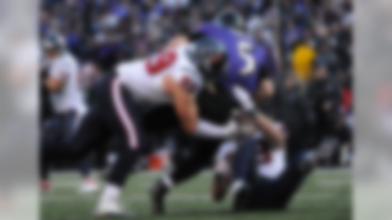 Houston Texans defensive end J.J. Watt #99 and outside linebacker Brooks Reed #58 sacking Baltimore Ravens quarterback Joe Flacco #5 during the American Football Conference Divisional Playoff game between the Houston Texans and the Baltimore Ravens on Sunday, January 15 2012, at M & T Bank Stadium, Baltimore, Maryland. The Ravens beat the Texans 20-13. (AP Photo/David Drapkin)