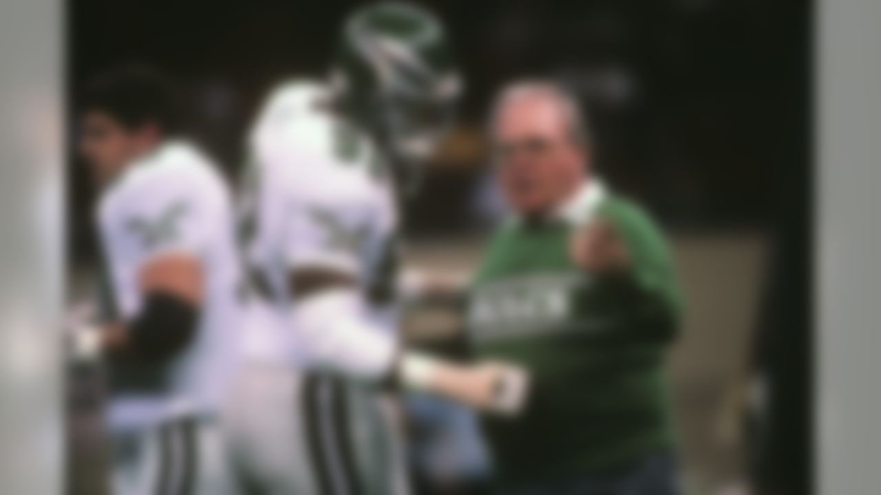 Philadelphia Eagles head coach Buddy Ryan directs play with defensive end Reggie White (92) in 1989 at an NFL football game. (Al Messerschmidt via AP)