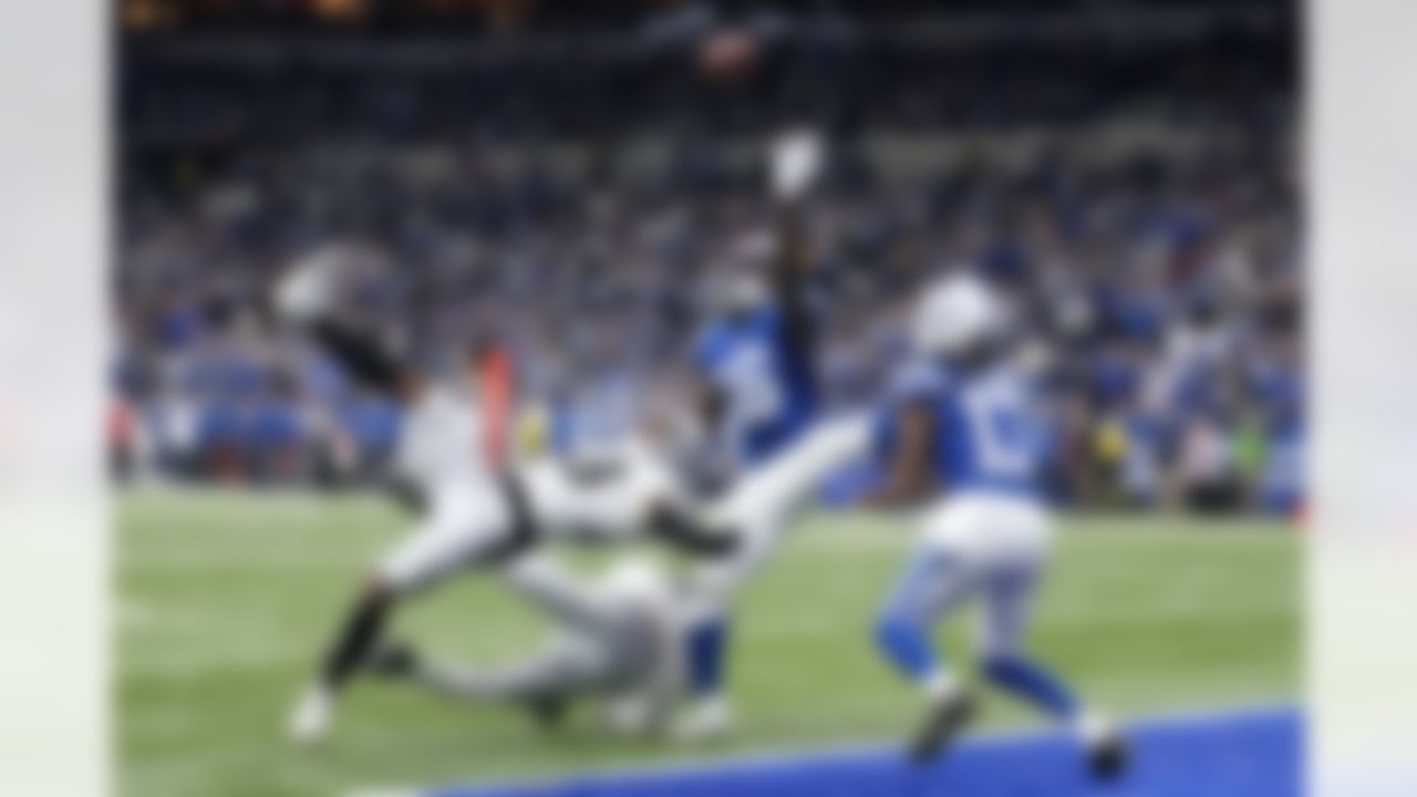 Indianapolis Colts wide receiver Ashton Dulin (16) tips a pass to teammate wide receiver T.Y. Hilton (13) in the end zone for a touchdown over Las Vegas Raiders cornerback Casey Hayward (29) during the second half of an NFL football game, Sunday, Jan. 2, 2022, in Indianapolis.