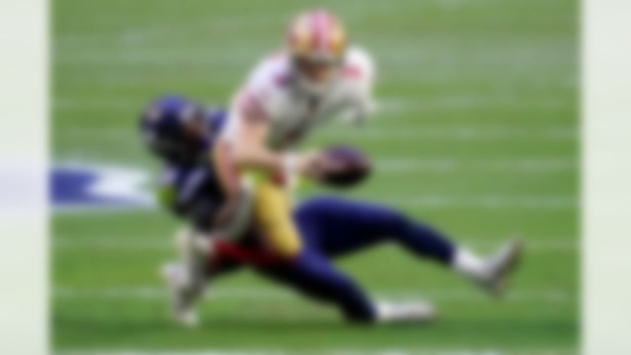 San Francisco 49ers quarterback C.J. Beathard (3) is sacked by Seattle Seahawks safety Ugo Amadi (28) during the first half of an NFL football game, Sunday, Jan. 3, 2021, in Glendale, Ariz.