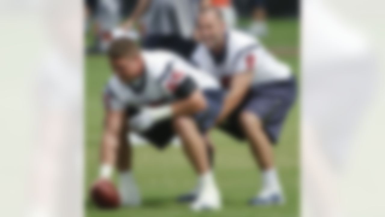 Houston Texans quarterback Matt Schaub (8) takes snaps from center Mike Brisiel (65) during an NFL football mini camp, Monday, May 24, 2010, in Houston. (AP Photo/Dave Einsel)