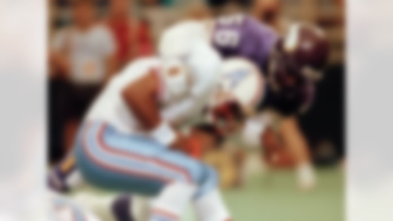 Vikings linebacker Chris Doleman brings down Oilers quarterback Warren Moon for a safety during preseason action in Minneapolis. (AP Photo/Jim Mone, File)