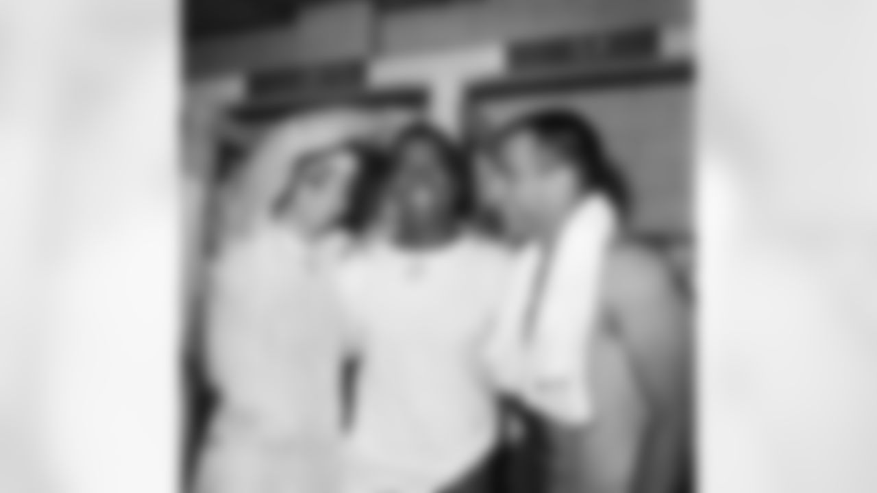 Three members of the Detroit Lions who played key roles in the club's 17-13 victory over the Green Bay Packers in the National Football League opener at Milwaukee County Stadium smile happily in the clubhouse after the game on Sept. 27, 1961. Left to right, quarterback Earl Morrall, who pitched a touchdown pass; Dick Lane, who snuffed out a late Green Bay threat with a pass interception, and Nick Pietrosante, who scored two touchdowns. (AP Photo/DVN)