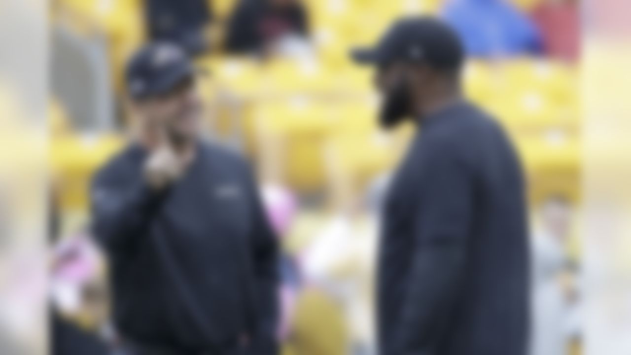 Pittsburgh Steelers head coach Mike Tomlin, right, and Baltimore Ravens head coach John Harbaugh talk before an NFL football game Sunday, Oct. 6, 2019, in Pittsburgh. (AP Photo/Don Wright)