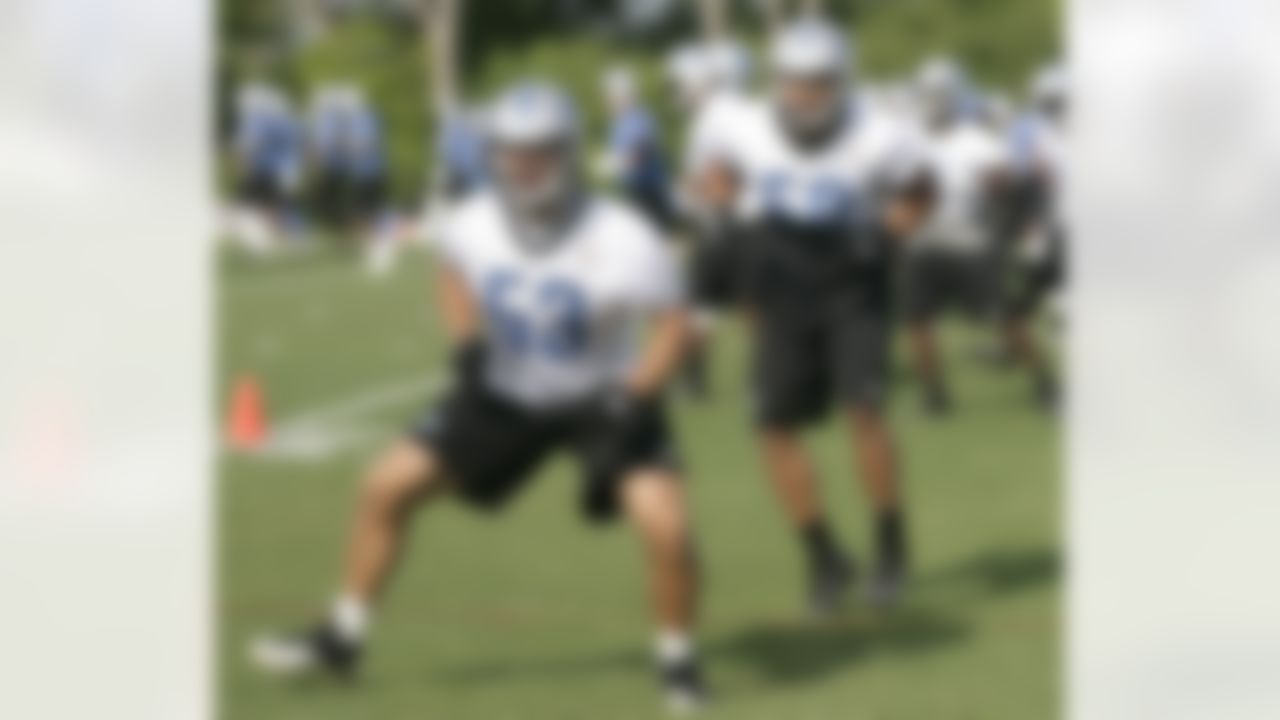 Detroit Lions linebackers Slade Norris (53) and Travis Lewis begin their morning workout during NFL football training camp Monday, Aug 13, 2012, in Allen Park, Mich. (AP Photo/Duane Burleson)