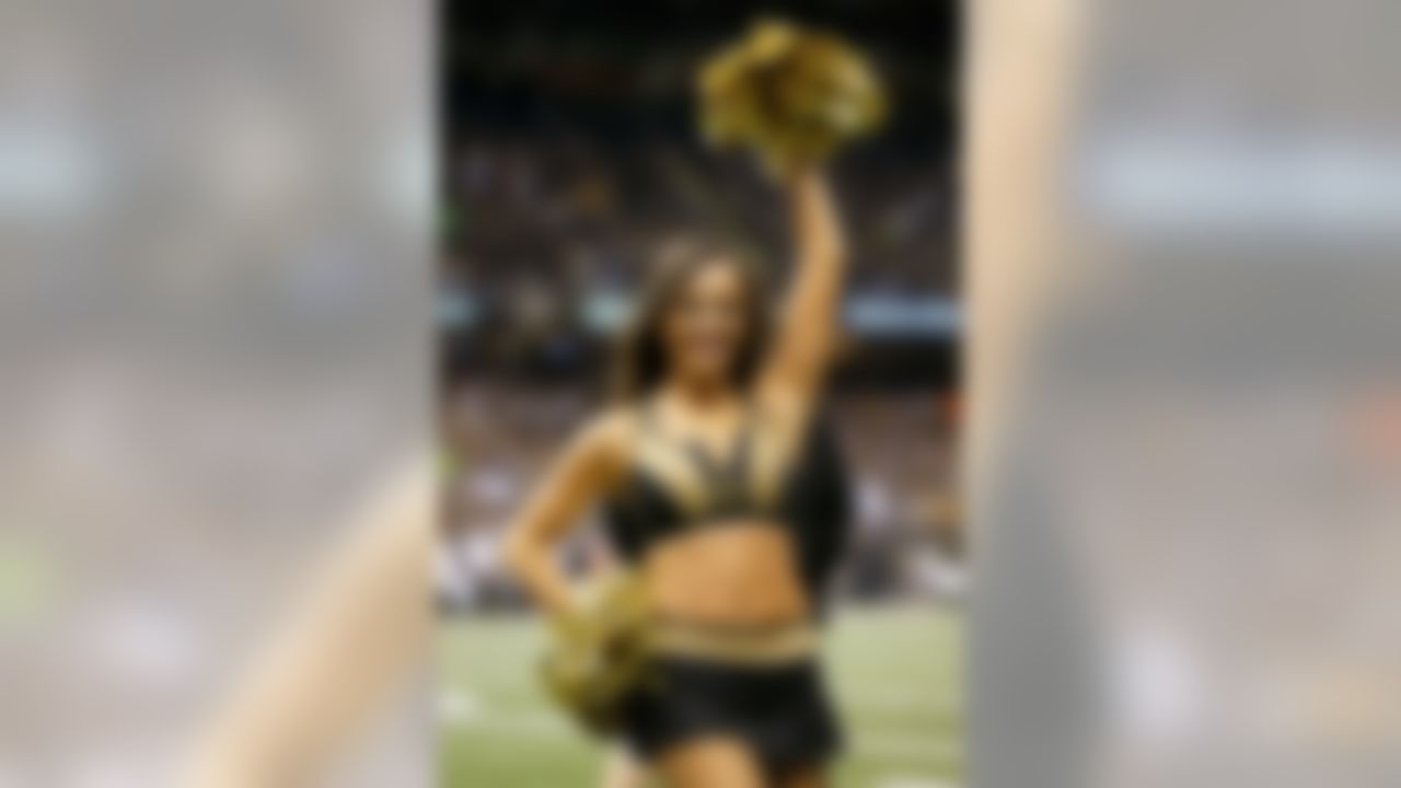 A New Orleans Saints cheerleader performs against the Baltimore Ravens during a week twelve NFL football game on Monday, Nov. 24, 2014 in New Orleans. (AP Photo/G. Newman Lowrance)