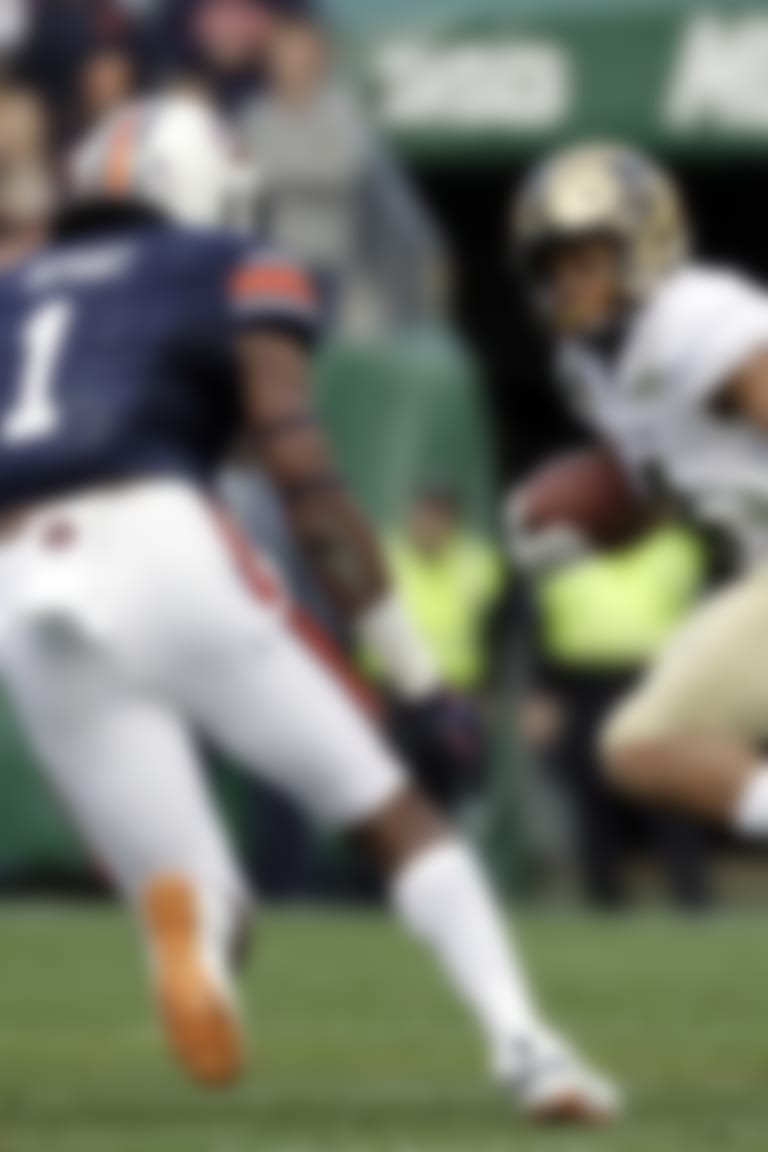 Purdue wide receiver Rondale Moore (4) tries to get past Auburn defenders Big Kat Bryant (1) and Darrell Williams (49) in the first half of the Music City Bowl NCAA college football game Friday, Dec. 28, 2018, in Nashville, Tenn. (AP Photo/Mark Humphrey)