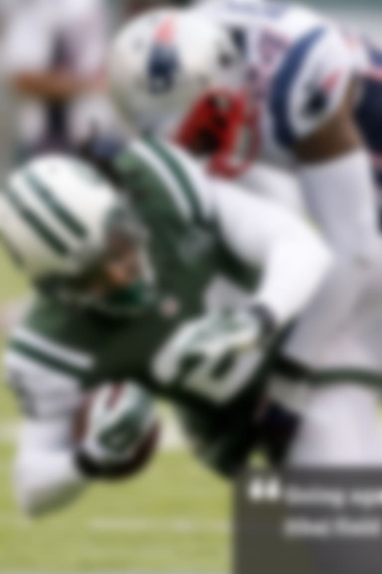 New England Patriots cornerback Darrelle Revis (24) tackles New York Jets' Chris Johnson (21) during the first half of an NFL football game Sunday, Dec. 21, 2014, in East Rutherford, N.J. (AP Photo/Julio Cortez)