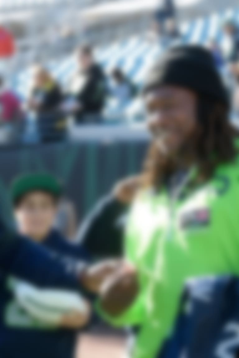 Seattle Seahawks cornerback Shaquill Griffin, left, talks with his brother, Central Florida linebacker Shaquem Griffin on the field before an NFL football game against the Jacksonville Jaguars Sunday, Dec. 10, 2017, in Jacksonville, Fla. (AP Photo/Phelan M. Ebenhack)