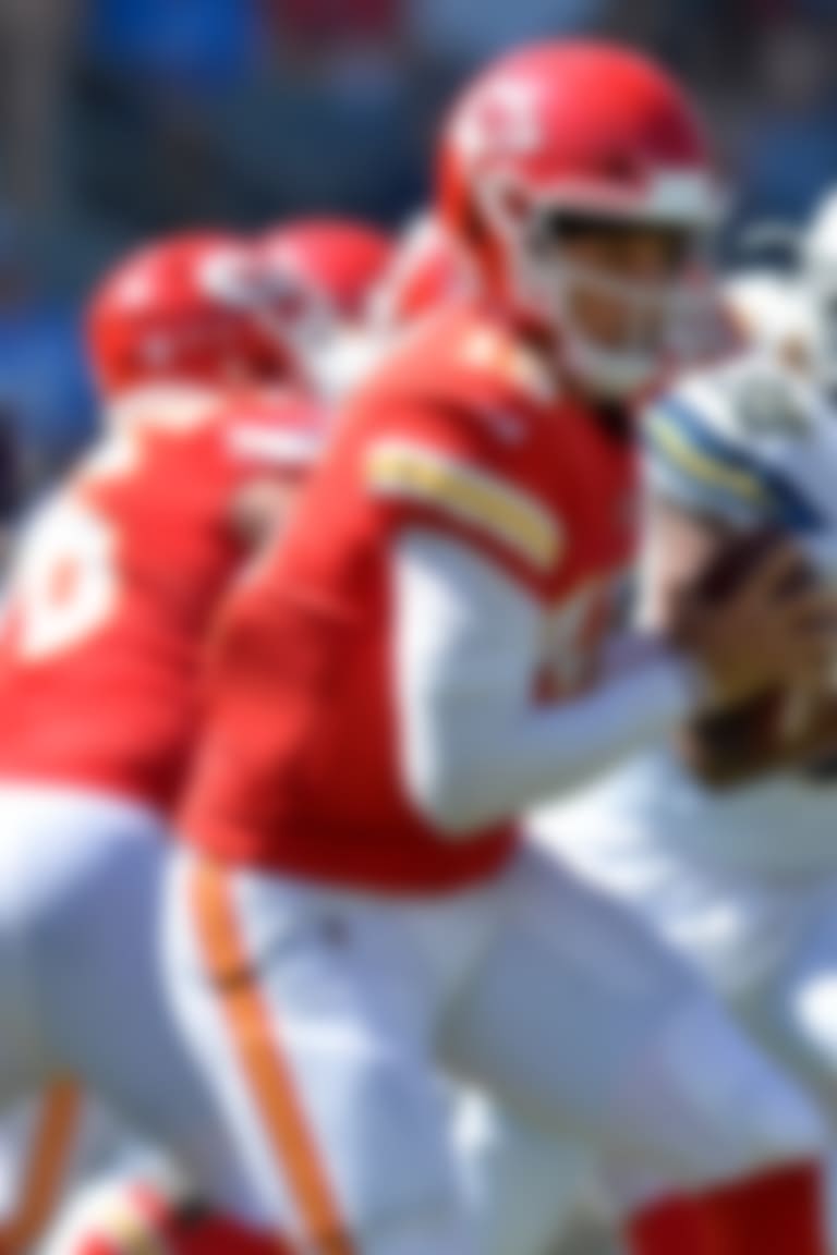 Sep 9, 2018; Carson, CA, USA; Kansas City Chiefs quarterback Patrick Mahomes (15) runs against Los Angeles Chargers defensive end Isaac Rochell (98) during the second quarter at StubHub Center. Mandatory Credit: Jake Roth-USA TODAY Sports