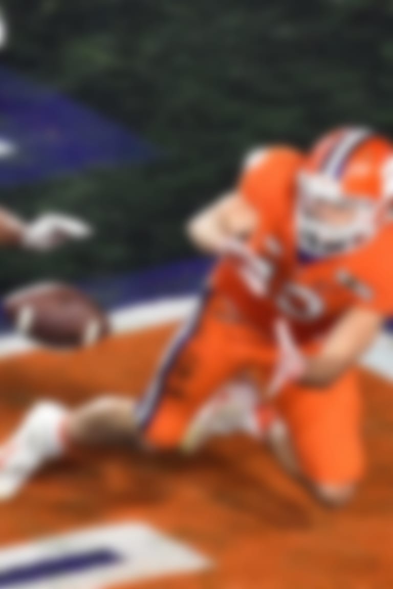 Jan 11, 2016; Glendale, AZ, USA; Clemson Tigers wide receiver Hunter Renfrow (13) scores a touchdown during the first quarter as he's defended by Alabama Crimson Tide defensive back Minkah Fitzpatrick (29) in the 2016 CFP National Championship at University of Phoenix Stadium. Mandatory Credit: Gary A. Vasquez-USA TODAY Sports