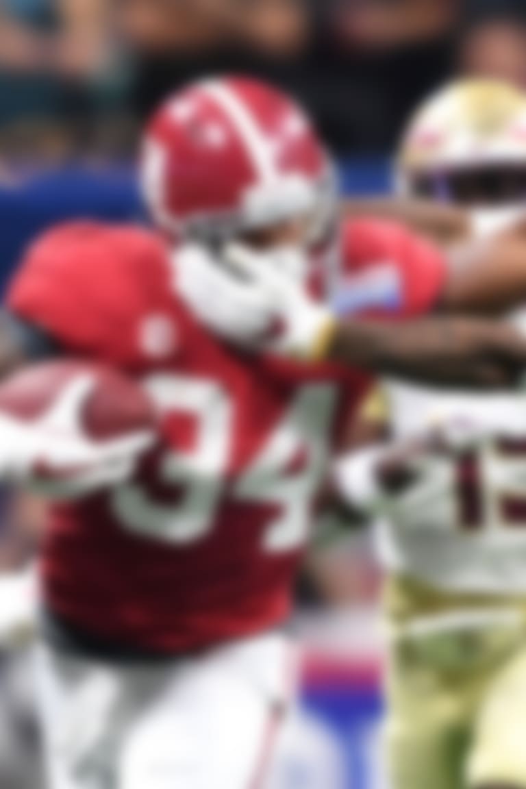 Sep 2, 2017; Atlanta, GA, USA; Alabama Crimson Tide running back Damien Harris (34) tries to stiff arm his way past Florida State Seminoles defensive back Derwin James (3) in the first quarter at Mercedes-Benz Stadium. Mandatory Credit: John David Mercer-USA TODAY Sports