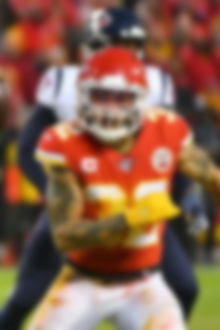 Jan 12, 2020; Kansas City, Missouri, USA; Houston Texans quarterback Deshaun Watson (4) as Kansas City Chiefs strong safety Tyrann Mathieu (32) defends during the AFC Divisional Round playoff football game at Arrowhead Stadium. Mandatory Credit: Denny Medley-USA TODAY Sports