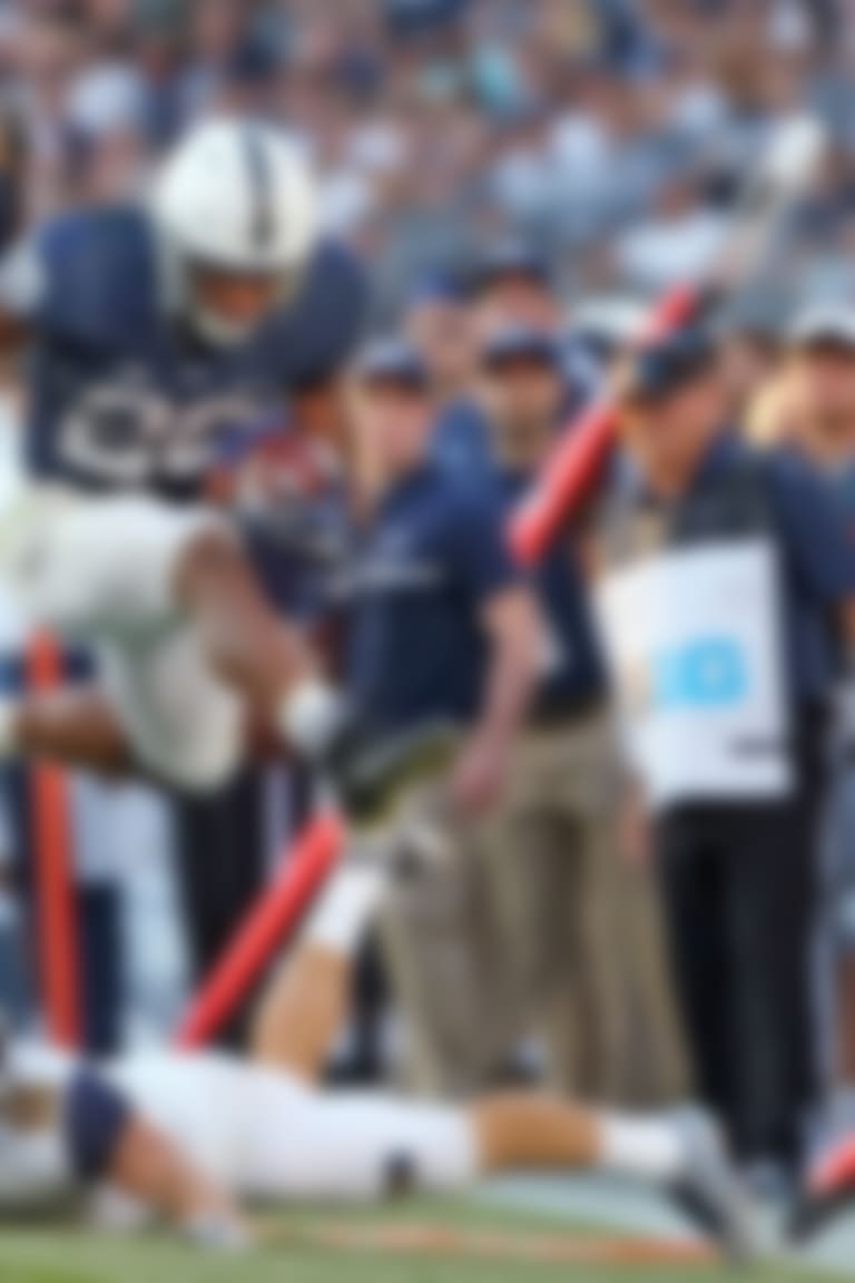 Penn State's Saquon Barkley (26) leaps past Kent State's Nate Holley (18) during the second half of an NCAA college football game in State College, Pa., Saturday, Sept. 3, 2016. Penn State won 33-13. (AP Photo/Chris Knight)