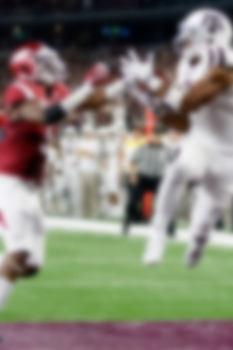 Texas A&M wide receiver Christian Kirk, right, pulls in a pass for a touchdown as Arkansas defensive back Henre' Toliver (5) reaches for the ball in overtime of an NCAA college football game on Saturday, Sept. 26, 2015, in Arlington, Texas. Texas A&M won 28-21. (AP Photo/Tony Gutierrez)