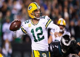 Rodgers buys time for ad-libbed 23-yard TD pass to Aaron Jones