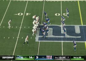 Kenneth Walker III slithers through a seam on a 16-yard rush