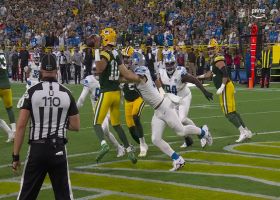 Jordan Love improvises with left-handed pass to avoid sack-safety by Hutchinson