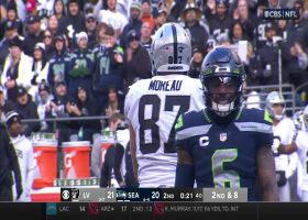 Foster Moreau takes a seat on the ground to catch Carr's 16-yard laser