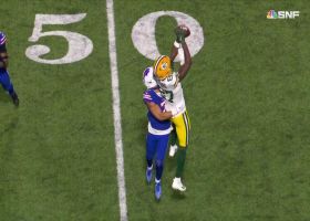 Romeo Doubs boxes out DB on Rodgers' 26-yard sideline strike