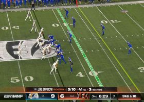 Chase reaches against his momentum on hands catch for a first down