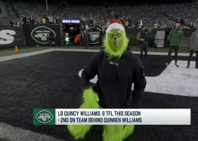 Quincy Williams wears a Grinch costume to warm-ups ahead of Jaguars-Jets
