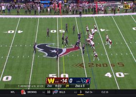 Heinicke slings 19-yard pass to Thomas while absorbing hit