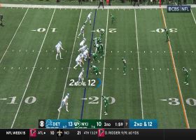 Goff fits tight window pass to St. Brown for 14-yard gain