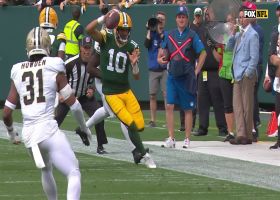 Jordan Love tightropes sideline for 24-yard scramble in crunch time