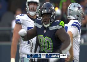 Jarran Reed swings down Cooper Rush for a Hawks' sack