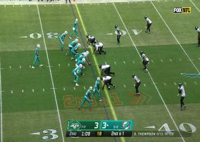 Jaylen Waddle shakes off two Jets' defenders for 15-yard gain