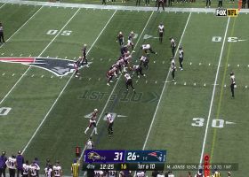 Malik Harrison turns Harris' undershirt into a towel on ripping tackle