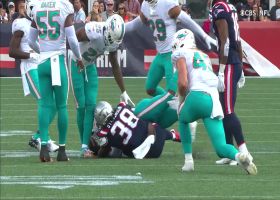 Eric Rowe rips ball from Rhamondre Stevenson for Fins takeaway