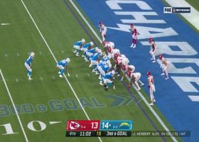 Tershawn Wharton paws ball from leaping Bolts' RB for critical takeaway at 1-yard line