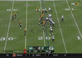 Rashan Gary appears in Wilson's peripherals on slamming third-down sack