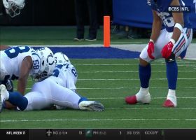 Bobby Okereke punches ball out from Slayton for Colts takeaway