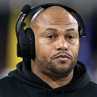 Las Vegas Raiders interim head coach Antonio Pierce stands on the sidelines before an NFL football game against the Los Angeles Chargers, Thursday, Dec. 14, 2023, in Las Vegas. (AP Photo/Steve Marcus)