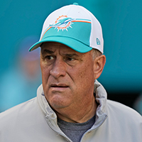 Miami Dolphins Defensive Coordinator Vic Fangio heads onto the field before the start of an NFL football game against the Carolina Panthers, Sunday, Oct. 15, 2023, in Miami Gardens, Fla. (AP Photo/Wilfredo Lee )