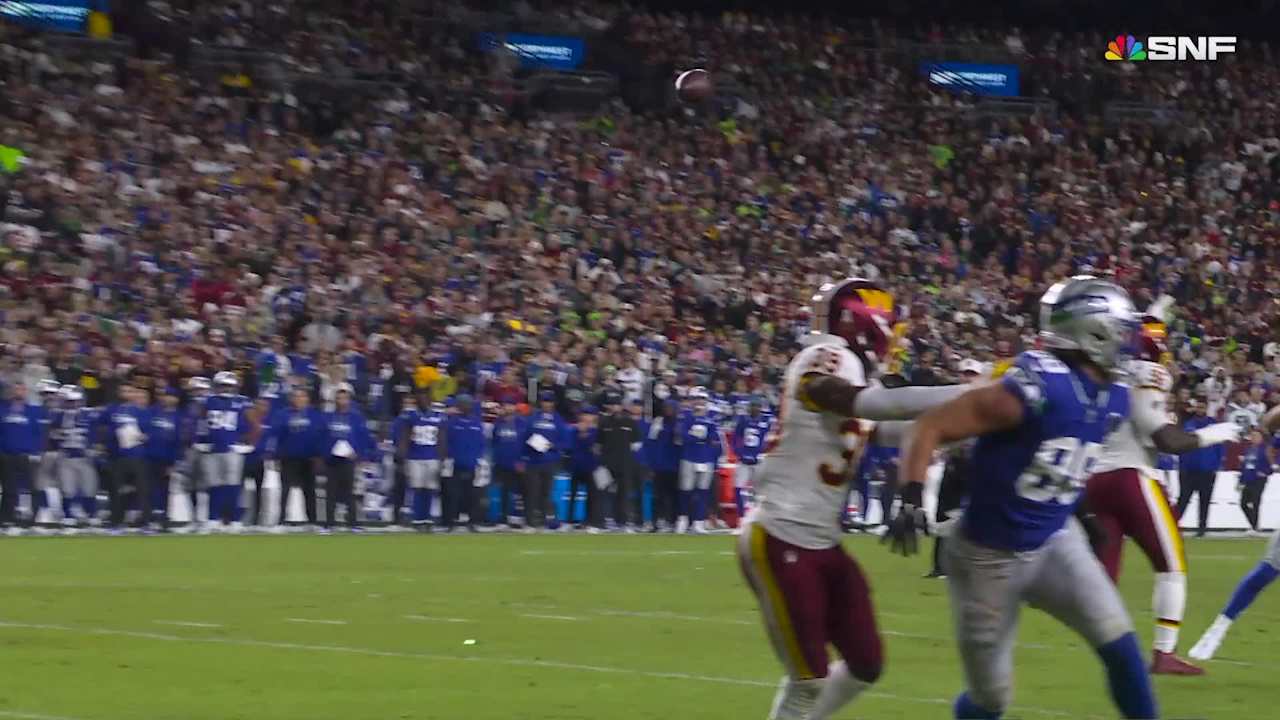 Seattle Seahawks quarterback Sam Darnold hits wide receiver Tory Horton ...