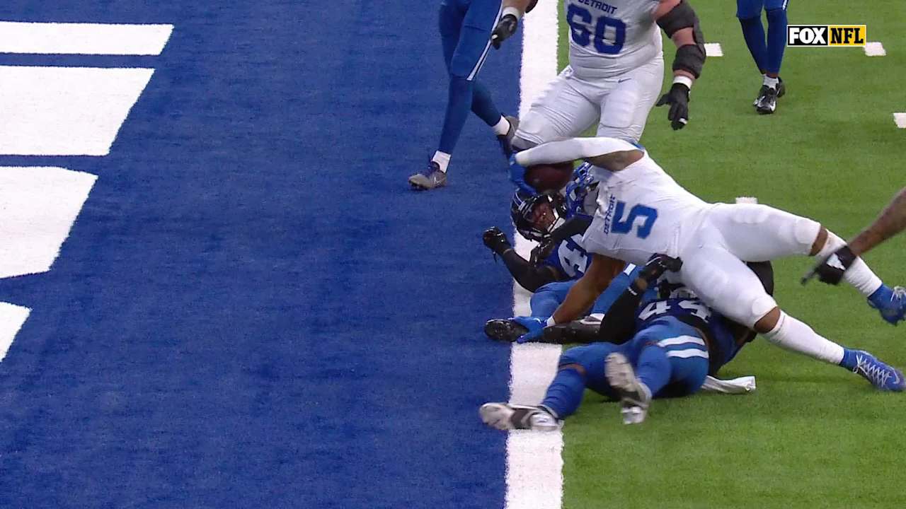Detroit Lions running back David Montgomery corkscrews past the goal ...