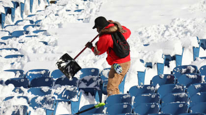 Bills fans help shovel as 18 inches of snow falls at Highmark Stadium