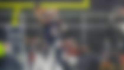 New England Patriots quarterback Drake Maye (10) rolls out of the pocket to make a pass during the second half of an NFL divisional playoff football game against the Houston Texans, Sunday, Jan. 18, 2026, in Foxborough, Mass. (AP Photo/Greg M. Cooper)