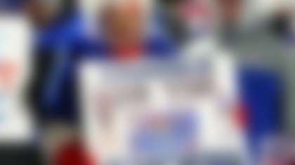 A Buffalo Bills fan holds a sign bidding farewell to Highmark Stadium during an NFL football game against the New York Jets in Orchard Park, N.Y., Sunday Jan. 4, 2026. (AP Photo/ Jeffrey T. Barnes)