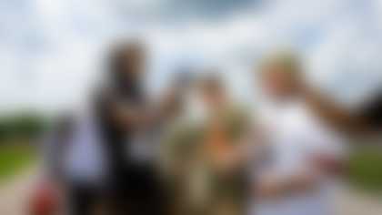 Cornerback Denzel Ward (21) with members of the military during OTA 8 at CrossCountry Mortgage Campus on June 4, 2024.