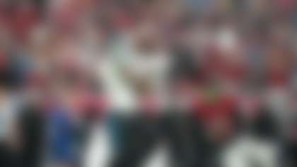 Carolina Panthers wide receiver Tetairoa McMillan (4) catches a deep pass as Tampa Bay Buccaneers cornerback Jacob Parrish (25) defends during an NFL football game, Sunday, Jan 3, 2026, in Tampa, Fla. (AP Photo/Peter Joneleit)