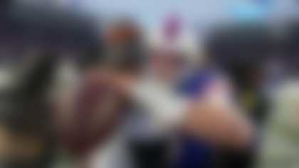 Buffalo Bills quarterback Josh Allen, right, embraces Cincinnati Bengals quarterback Joe Burrow after an NFL football game, Sunday, Dec. 7, 2025, in Orchard Park, N.Y. (AP Photo/Gene J. Puskar)