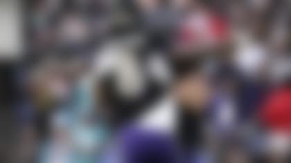 Baltimore Ravens quarterback Lamar Jackson (8) celebrates with Patrick Ricard after their tocudhown against the Miami Dolphins during the second half of an NFL football game in Baltimore, Sunday, Dec. 31, 2023. (AP Photo/Nick Wass)