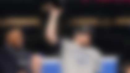 Michael Strahan, left, watches as Seattle Seahawks quarterback Sam Darnold celebrates after the NFC Championship NFL football game against the Los Angeles Rams, Sunday, Jan. 25, 2026, in Seattle. (AP Photo/Godofredo A. Vásquez)